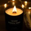A detailed macro shot of a bright candle flame flickering with a perfectly centered cotton wick.