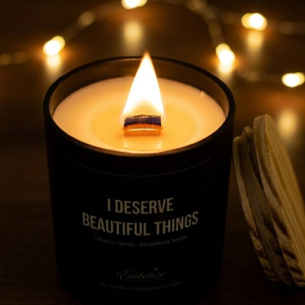A detailed macro shot of a bright candle flame flickering with a perfectly centered cotton wick.