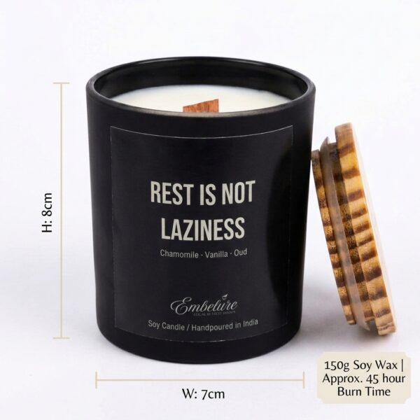 A hand holding the 150g glass candle jar to show its compact and portable size
